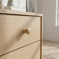 30 mm flared oak puidust mööblinupp installed on cabinet door